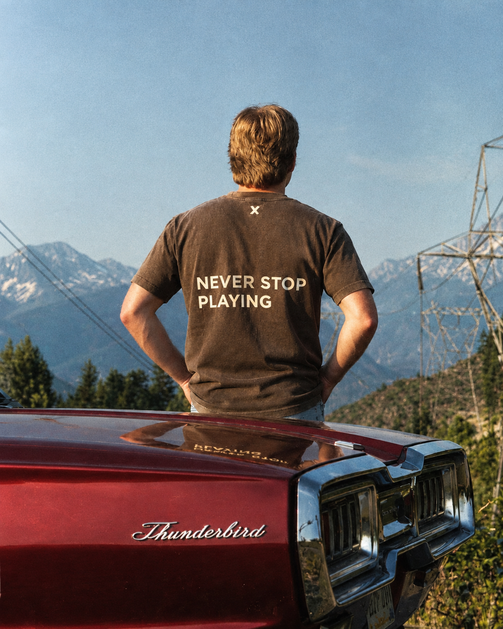 NEVER STOP PLAYING TEE